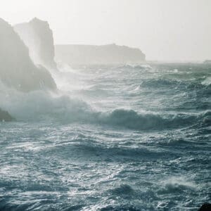 A beautiful scenery of Atlantic Ocean sea waves crashing over rock formations
